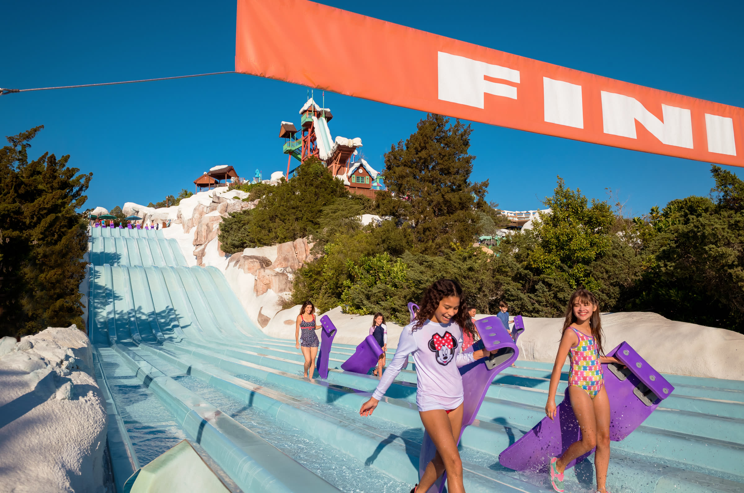 Family water park slide finish line on a sunny day